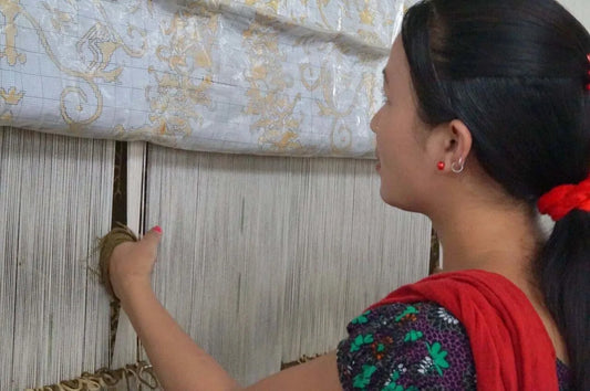 women weaving handmade rugs