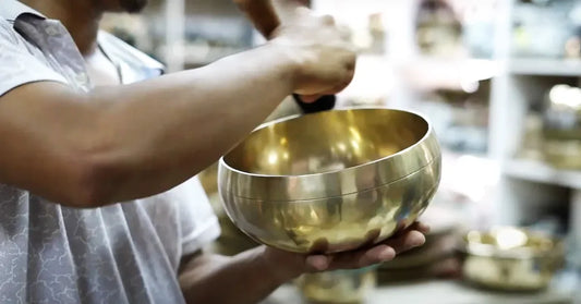 person holding a singing bowl