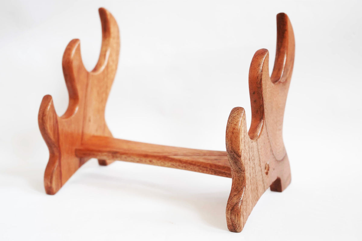 Wooden archery bow stand on a white background
