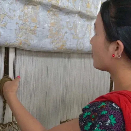 women weaving handmade rugs